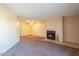 Cozy living room featuring a fireplace and neutral-toned walls and carpets at 11640 N 51St Ave # 248, Glendale, AZ 85304