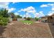 Backyard with a fire pit, manicured lawn, and lush landscaping at 1210 W Missouri Ave, Phoenix, AZ 85013