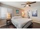 Bedroom featuring a ceiling fan and an attached bathroom at 1210 W Missouri Ave, Phoenix, AZ 85013
