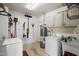 Laundry room with a washer, dryer, and utility sink at 1210 W Missouri Ave, Phoenix, AZ 85013