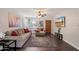 Inviting living room with modern decor, wood-look floors, and a ceiling fan, creating a cozy and stylish space at 1210 W Missouri Ave, Phoenix, AZ 85013