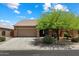 Charming single-story home featuring a well-maintained yard and a two-car garage in a Gathering-friendly neighborhood at 125 N 107Th Dr, Avondale, AZ 85323