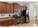 Well-appointed kitchen boasts stainless steel appliances, ample cabinet space, and durable countertops for easy meal preparation at 125 N 107Th Dr, Avondale, AZ 85323