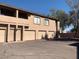 Townhouse exterior featuring garages and private entrances in a well-maintained complex at 1406 W Emerald Ave # 124, Mesa, AZ 85202