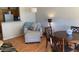 Comfortable living area with hardwood floors and a cozy seating area next to the kitchen at 1406 W Emerald Ave # 124, Mesa, AZ 85202