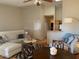 Inviting living room with comfortable seating, kitchen bar and hardwood floors at 1341406 W Emerald Ave # 124, Mesa, AZ 85202