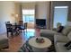 Comfortable living room featuring a cozy seating area and a dining table with natural light at 1341406 W Emerald Ave # 124, Mesa, AZ 85202