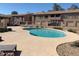 Community pool surrounded by a concrete deck, perfect for relaxation and leisure at 1406 W Emerald Ave # 124, Mesa, AZ 85202