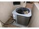 A newer model home air conditioning unit is shown, set outside on gravel at 14000 N 94Th St # 1031, Scottsdale, AZ 85260