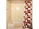 Shower-tub combo featuring a tan shower curtain with red and brown circles at 14000 N 94Th St # 1031, Scottsdale, AZ 85260