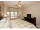 Bright bedroom featuring a large window, comfortable bed, and dark wood furniture at 14000 N 94Th St # 1031, Scottsdale, AZ 85260