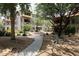 View of a building exterior with a walkway and desert landscaping at 14000 N 94Th St # 1031, Scottsdale, AZ 85260