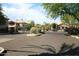 Community entrance gate with security access and mature landscaping at 14000 N 94Th St # 1031, Scottsdale, AZ 85260