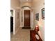 Inviting entryway featuring tiled flooring, a decorative table, and arched transom for a warm welcome at 14000 N 94Th St # 1031, Scottsdale, AZ 85260