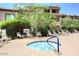 Apartment community hot tub with lounge chairs at 14000 N 94Th St # 1031, Scottsdale, AZ 85260