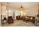 Bright living room with ceiling fan, plush seating, and doors to outdoor patio create a comfortable living space at 14000 N 94Th St # 1031, Scottsdale, AZ 85260