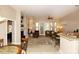 Spacious living area featuring built-in shelving, fireplace, patio access, and seamless flow to dining area at 14000 N 94Th St # 1031, Scottsdale, AZ 85260