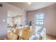 Charming dining room with wood floors connects to a bright living space, perfect for entertaining at 1551 W Vernon Ave, Phoenix, AZ 85007