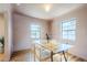 Inviting dining room features natural light, wood floors, and comfortable seating for a pleasant dining experience at 1551 W Vernon Ave, Phoenix, AZ 85007