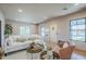Inviting living room with hardwood floors, a plush sofa, and ample natural light at 1551 W Vernon Ave, Phoenix, AZ 85007