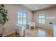 Sunlit living room with hardwood floors, plush seating, and large windows creates an inviting atmosphere at 1551 W Vernon Ave, Phoenix, AZ 85007