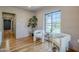 Bright living area with hardwood floors, stylish seating, and large windows create a welcoming ambiance at 1551 W Vernon Ave, Phoenix, AZ 85007