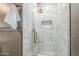 Modern bathroom featuring marble tiled shower with gold fixtures and a built-in niche at 1551 W Vernon Ave, Phoenix, AZ 85007