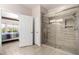 Modern bath with tiled shower and glass door located near the main bedroom at 16280 W Desert Winds Dr, Surprise, AZ 85374