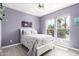 Cozy bedroom featuring soothing paint, natural light, and tiled floors at 16280 W Desert Winds Dr, Surprise, AZ 85374