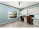 Bright office with large window, built-in shelves, and tile floor at 16280 W Desert Winds Dr, Surprise, AZ 85374
