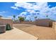 Spacious rockscaped backyard with covered patio and block fence at 1654 S 77Th St, Mesa, AZ 85209