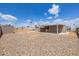 Rockscaped backyard with covered patio and block fence for added privacy at 1654 S 77Th St, Mesa, AZ 85209