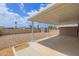 The home features a rockscaped backyard with a covered patio at 1654 S 77Th St, Mesa, AZ 85209