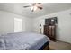 Relaxing bedroom with a large bed, dresser and sliding door closet at 1654 S 77Th St, Mesa, AZ 85209