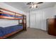 Bedroom with bunk beds, closet, and dresser at 1654 S 77Th St, Mesa, AZ 85209