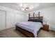 Cozy bedroom with a large bed, and closet with sliding doors at 1654 S 77Th St, Mesa, AZ 85209
