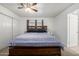 Comfortable bedroom featuring a large bed, ceiling fan, and closet at 1654 S 77Th St, Mesa, AZ 85209