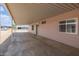Covered carport providing ample space for parking and protection from the elements, ensuring convenience at 1654 S 77Th St, Mesa, AZ 85209