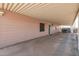 Spacious carport with ample room for parking and storage, offering protection from the elements at 1654 S 77Th St, Mesa, AZ 85209