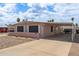 Single-story home with a covered carport and gravel landscaping providing minimal upkeep at 1654 S 77Th St, Mesa, AZ 85209