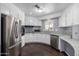 Bright kitchen featuring stainless steel appliances, granite counters, and wood-look floors at 1654 S 77Th St, Mesa, AZ 85209