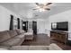 Relaxing living room with a comfortable sofa, television, and cozy atmosphere at 1654 S 77Th St, Mesa, AZ 85209