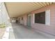 The covered patio has a fence and door leading into the home at 1654 S 77Th St, Mesa, AZ 85209