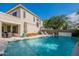 Beautiful backyard featuring a pool, covered patio, and ample space at 18868 E Mockingbird Dr, Queen Creek, AZ 85142