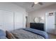 Comfortable bedroom with a large closet, dark wood dresser, and a ceiling fan for a welcoming space at 18868 E Mockingbird Dr, Queen Creek, AZ 85142