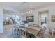 Dining room featuring stylish wood table, modern lighting, and art at 18868 E Mockingbird Dr, Queen Creek, AZ 85142
