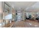 Bright foyer leading to a living room with hardwood floors, a large mirror, and natural light at 18868 E Mockingbird Dr, Queen Creek, AZ 85142