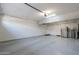 Clean garage space featuring epoxy floors and extra refrigerator at 18868 E Mockingbird Dr, Queen Creek, AZ 85142