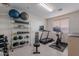 Home gym equipped with workout equipment and weights for a healthy lifestyle right at home at 18868 E Mockingbird Dr, Queen Creek, AZ 85142