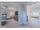 Hallway showcasing access to a living room and a secondary seating area, connecting the home at 18868 E Mockingbird Dr, Queen Creek, AZ 85142